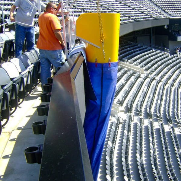 Removing snow from the upper level of a stadium using a Superchute snow chute.