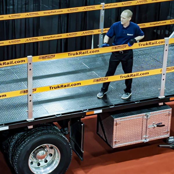 TrukRail protecting a worker on a flatbed truck.